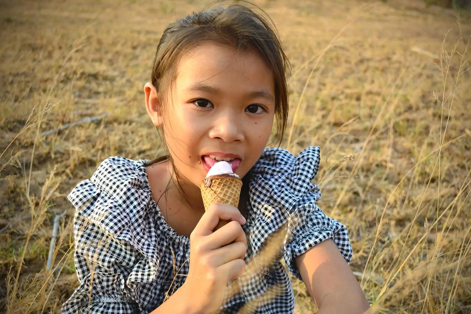 little girl eating ice cream cone