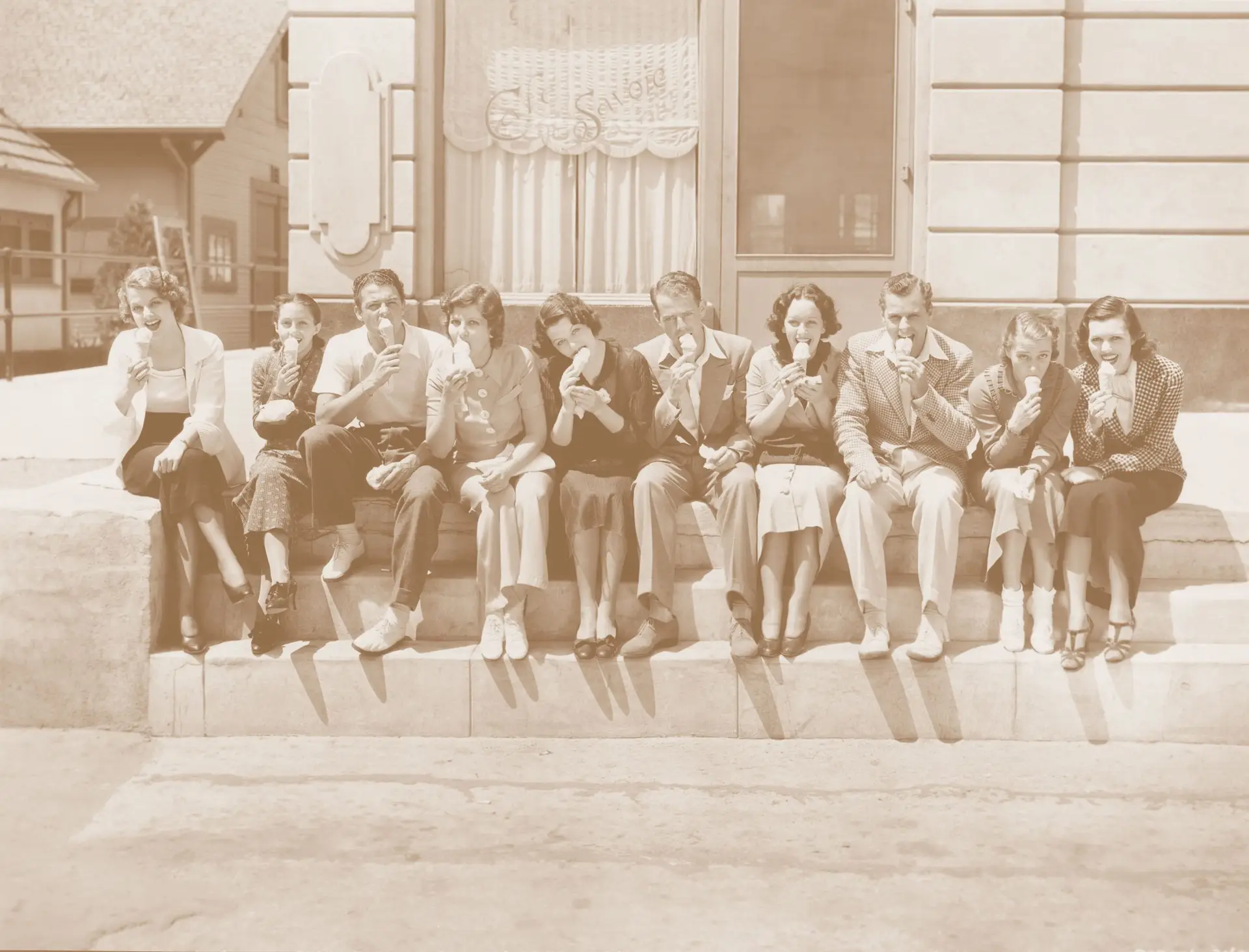 vintage photograph of adults eating gelato (ice cream)